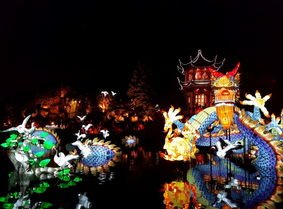 The Chinese gardens in Montreal lit up by lights at night.